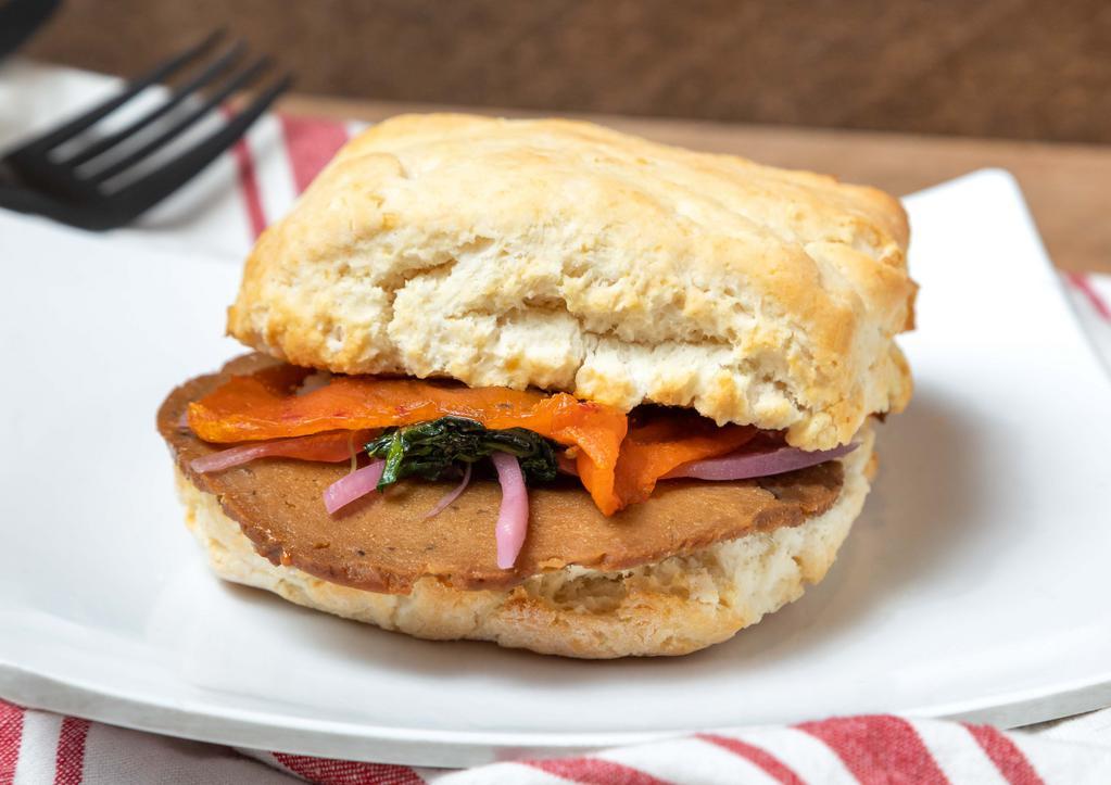 Vegan Sandwich · Mushroom field roast, Chao spicy vegan cheese, pickled onions, micro arugula, stout mustard, on a vegan biscuit.