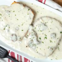 Southern Style Gravy On A Butterhole Biscuit · With white sausage gravy (not gluten free).