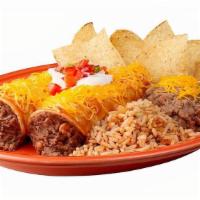 Enchilada Platter · Two white corn tortilla enchiladas with fat-free pinto beans, beef or chicken. Covered with ...