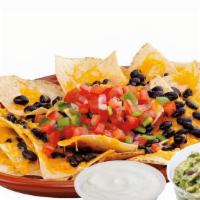 Nachos · Hand crafted corn tortilla chips loaded with a blend of aged Cheddar and low-fat white chees...