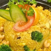 Pineapple Fried Rice · inspired by yellow curry flavors,stir fried with egg ,Pineapple ,raisins,yellow onion brocco...