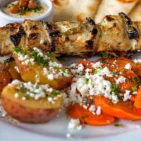 Chicken Souvlaki · Hand cut marinated chicken breast skewer char-broiled, served with a choice of greek lemon p...