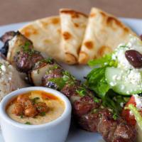 Beef Souvlaki · Hand cut marinated beef char-broiled, served with a choice of greek lemon potatoes, rice pil...