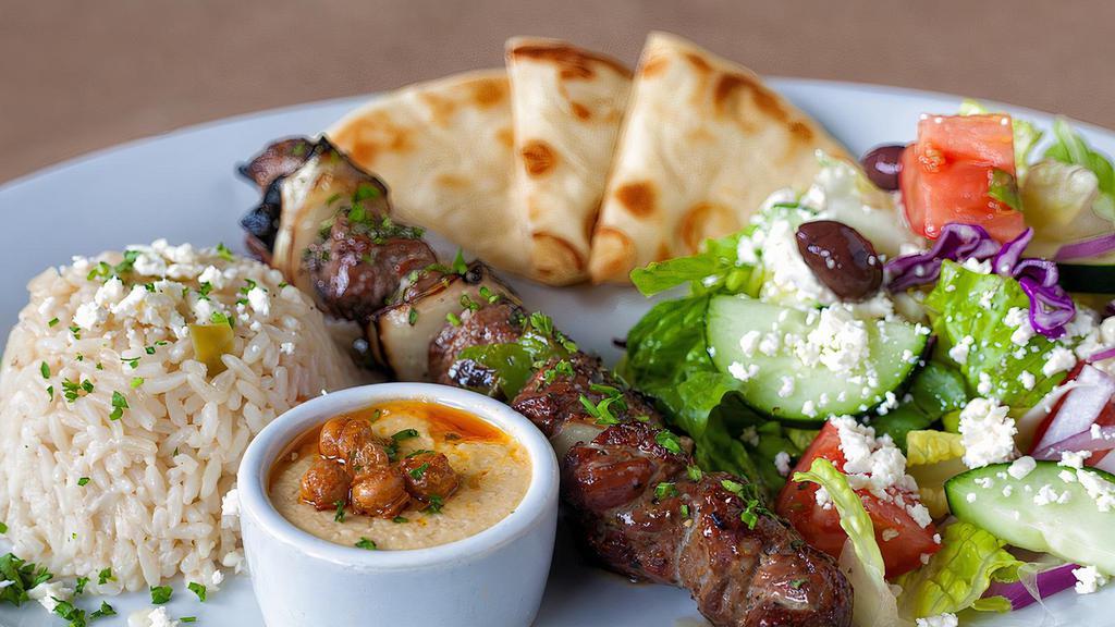 Lamb Souvlaki · Hand cut marinated lamb skewer char-broiled, served with a choice of greek lemon potatoes, rice pilaf, or greek fries, also braised fresh vegetables and pita bread.