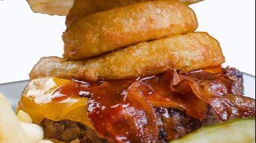Western Bacon Burger · Fresh grilled ground chuck patty, topped with our house BBQ sauce, applewood bacon, cheddar cheese and onion rings