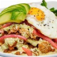 Chilaquiles · House-made chili rojo sauce, shredded chicken and hand-cut corn tortillas topped with your c...