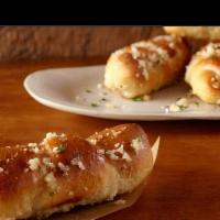 Garlic Rolls(5) · Rolled bread tossed and baked in garlic and Romano cheese