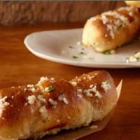 Garlic Rolls (10) · Rolled bread tossed and baked in garlic and Romano cheese
