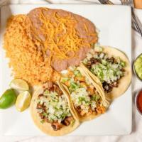 Three Street Tacos · 3 street tacos with your choice of meat topped with onions, cilantro and cabbage (shrimp tac...