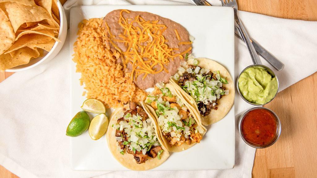 Three Street Tacos · 3 street tacos with your choice of meat topped with onions, cilantro and cabbage (shrimp taco topped with mayo). Served with rice and refried beans.