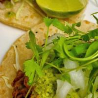 Bbq Rib Tacos (Ea) · Shredded island style BBQ rib, cabbage, sweet onion, cilantro, and fresh salsa verde served ...
