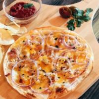 Flammkuchen · I'm not a pizza! A German dish. Thin crust on the base, top with sour cream, onion, bacon pi...