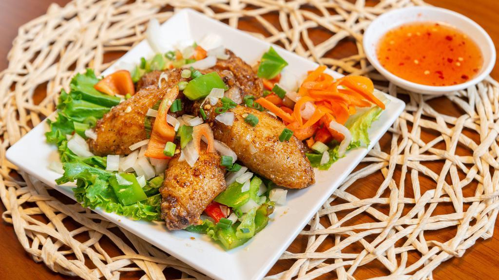  Tamarind Chicken Wings (5 Pieces) · Marinated with butter and deep-fried chicken wings, tossed with garlic and onion.