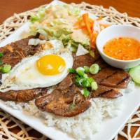Com Grilled Pork Chop · with fried egg.