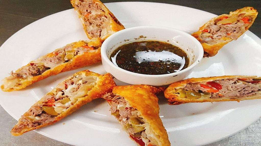 Italian Beef Egg Rolls · The perfect mixture of juicy Italian beef, shredded mozzarella cheese and *hot giardiniera*.   All tightly wrapped up in an egg roll and deep fried until golden brown.   Served with a side of au jus for dipping.
**EGG ROLLS COME AS IS-GIARDINIERA CAN NOT BE REMOVED**
