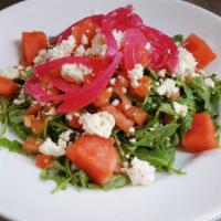 Watermelon & Arugula Salad · Freshly picked arugula, sweet watermelon, pickled red onions,
 diced tomatoes and crumbled F...