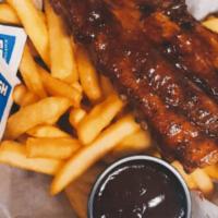 Rib Basket · A smaller portion of our anyway’s famous ribs served in a basket with French fries & a side ...