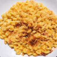 Crusted Macaroni & Cheese · Curly macaroni noodles, smoked bacon pieces, caramelized onions, & diced tomatoes all tossed...