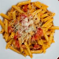 Vodka Pasta · Grilled chicken strips, sliced mushrooms, diced prosciutto ham, and penne pasta sauteed with...