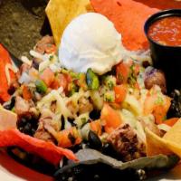 Burrito Bowl · Your choice of chicken, ground beef, or steak, with black beans, cilantro lime rice, jack ch...