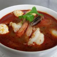 Tom Yum Soup · Choice of chicken or shrimps or tofu in spicy sour soup with mushroom, onion and herbs.
