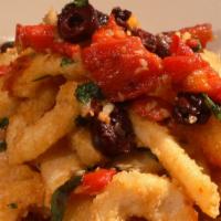 Calamari Fritti · Tossed with sautéed kalamata olives, roasted red peppers and basil with fresh garlic served ...