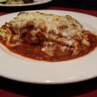 Lasagna · Stacked high with tender pasta, seasoned beef,  Italian cheese blend, herbs and our own bolo...