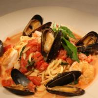 Linguine Frutti Di Mare · Shrimp, scallops and mussels with spinach, diced tomatoes and light lemon cream sauce tossed...