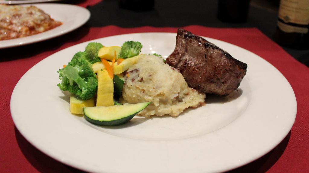 Filet Mignon · Gluten-free. 6 oz. filet mignon over garlic mashed potatoes with zip sauce and vegetable medley.