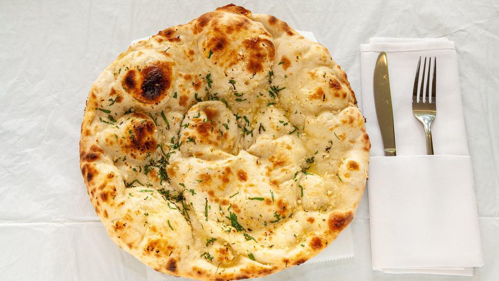 Garlic Naan · (Bread stuffed with garlic and herbs)