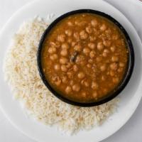 Chana Masala · Cheak peas and potatoes cooked with tomatoes and spices. Served with bashmoti rice pilaf.