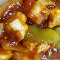 Chili Paneer · Gluten Free. (Cottage cheese cubes mixed with bell pepper and onions in tomato)
