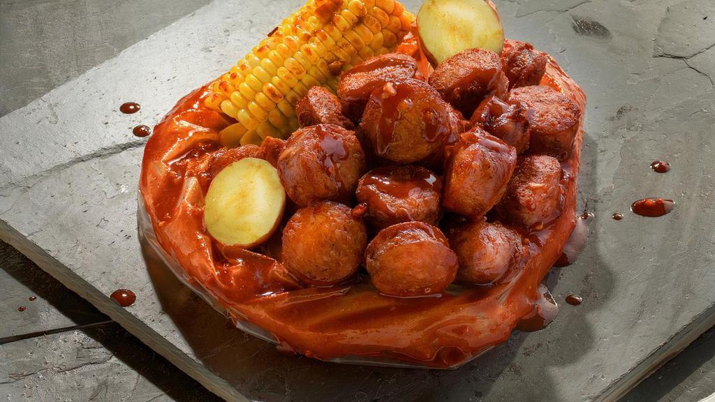 Sausage · Spicy Andouille Sausage boiled with a perfect balance of garlic, lemon pepper, and cajun spices. Served with corn and potatoes.