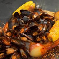 Mussels · Meaty Mussels drenched with a perfect balance of garlic, lemon pepper, and cajun spices. Ser...