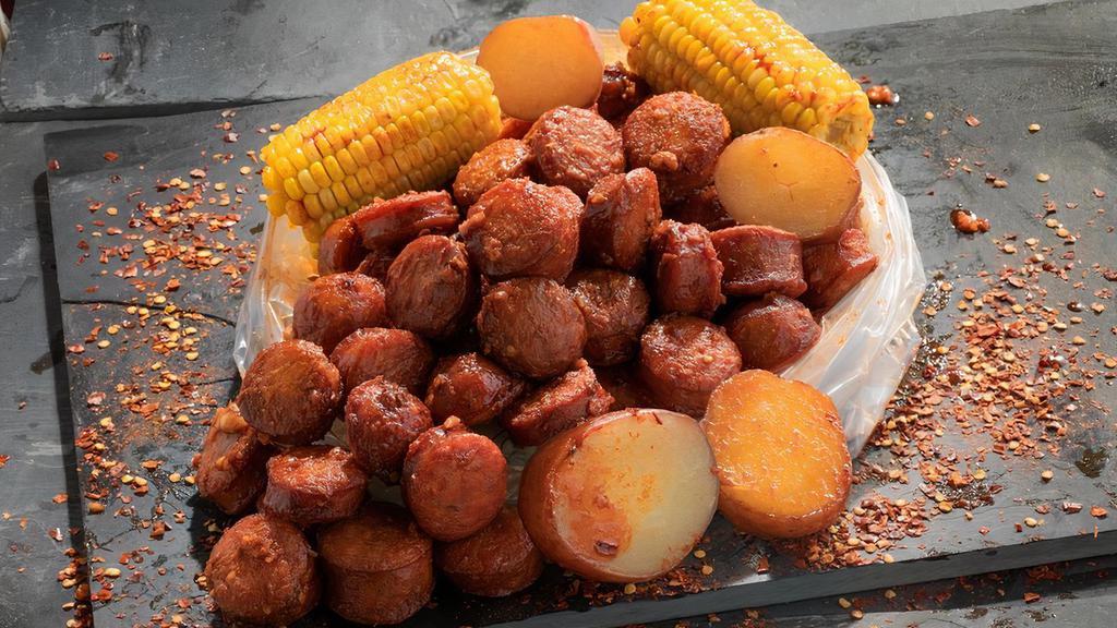 Sausage · Spicy Andouille Sausage boiled with a perfect balance of garlic, lemon pepper, and cajun spices. Served with corn and potatoes.