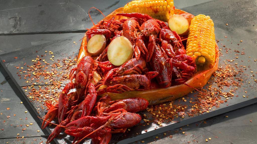 Crawfish (Seasonal) · Louisiana-Style Crawfish with a perfect balance of garlic, lemon pepper, and cajun spices. Served with corn and potatoes.