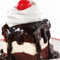 Hot Fudge Cake · Vanilla Ice Cream sandwiched between two hot fudge cakes, smothered with hot fudge and toppe...