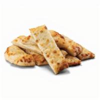 Cheesy Breadsticks · Each order starts with 8-sticks of made-from-scratch dough and a delicious garlic sauce topp...