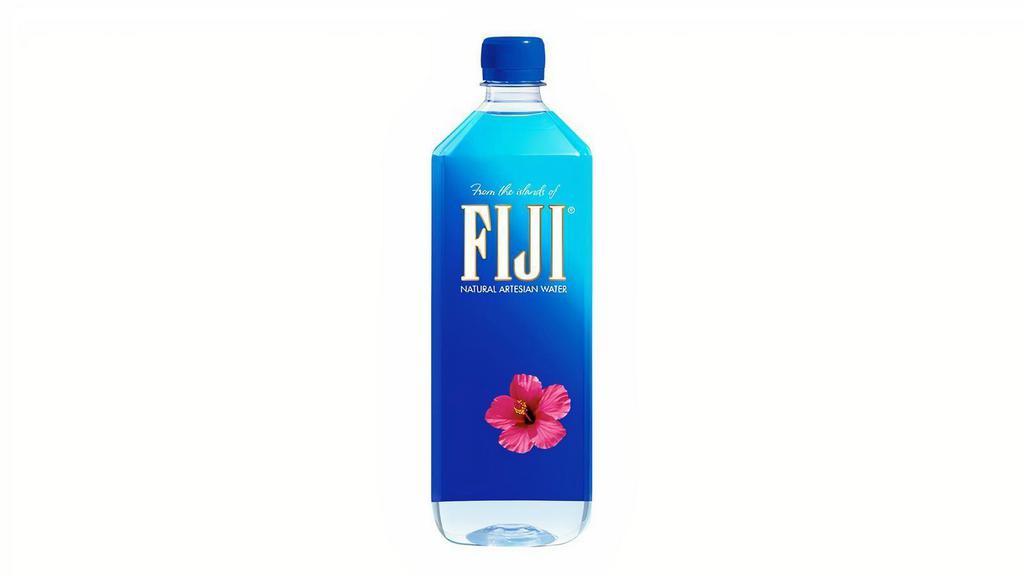 Fiji Water 1L · Enjoy the fresh, clear taste of FIJI Natural Artesian Water. It offers users' an option for quenching their thirst on hot days. FIJI natural water is actually filtered through volcanic rock, gathering minerals and electrolytes to leave it crisp and smooth.