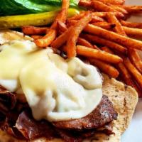 Philly Dilly Sandwich · Thin slices of sirloin steak on French bread with grilled mushrooms, grilled onions, and Pro...