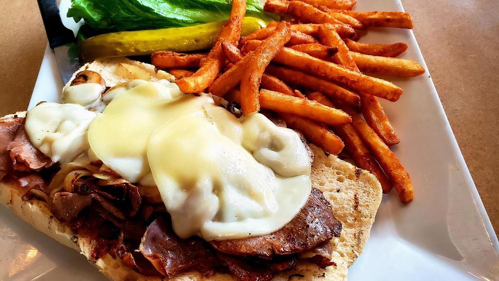 Philly Dilly Sandwich · Thin slices of sirloin steak on French bread with grilled mushrooms, grilled onions, and Provolone cheese. Served with giardiniera peppers on the side. All of our sandwiches are served with French fries and a pickle.