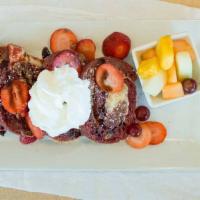 Red Velvet French Toast · Thick slices of red velvet cake with cream cheese, topped with fresh strawberries, white cho...