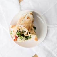 Falafel Wrap · Spread with hummus and filled with tomato,  , cucumber and lettuce.