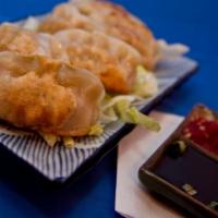 Fried Dumpling (6 Pcs.) · Wheat flour pork, cabbage, green onion and ginger.