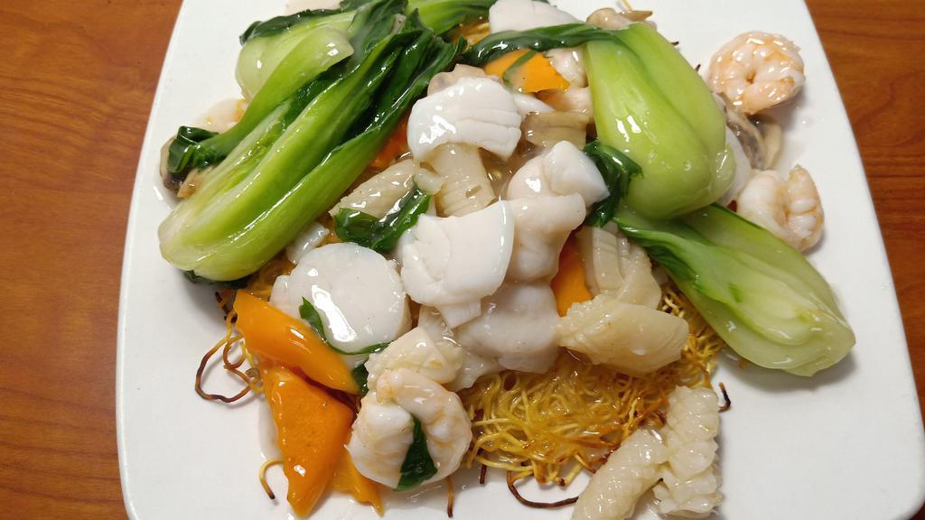Seafood Pan Fried Noodle · Shrimp, scallop, squid, fish, baby bokchoy, mushroom, carrot, and pan fried egg noodle.
