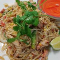 Pork Pad Thai · Wok-tossed thai rice noodles with bbq pork, egg, bean sprout, scallions and onion, fish sauc...
