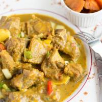 Curry Goat · Chunks of goat meat seasoned with a blend of curry powder, then simmered with chunks of onio...