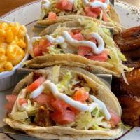 Jamrock Jerk Shrimp Tacos · Three tacos. Served with choice of two sides.