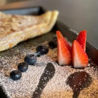 The Li8Ht Crepe · Cane sugar, strawberry, and toasted almonds.