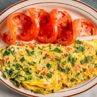 Greek Feta Omelette · Made with feta cheese, tomato and onion.